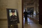 A photograph of the late U.S. Capitol Police Officer Brian Sicknick in the U.S. Capitol in Washington, D.C., U.S., on Tuesday, Feb. 2, 2021. 