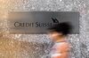 A pedestrian walks past the Credit Suisse Group AG headquarters in New York, U.S.