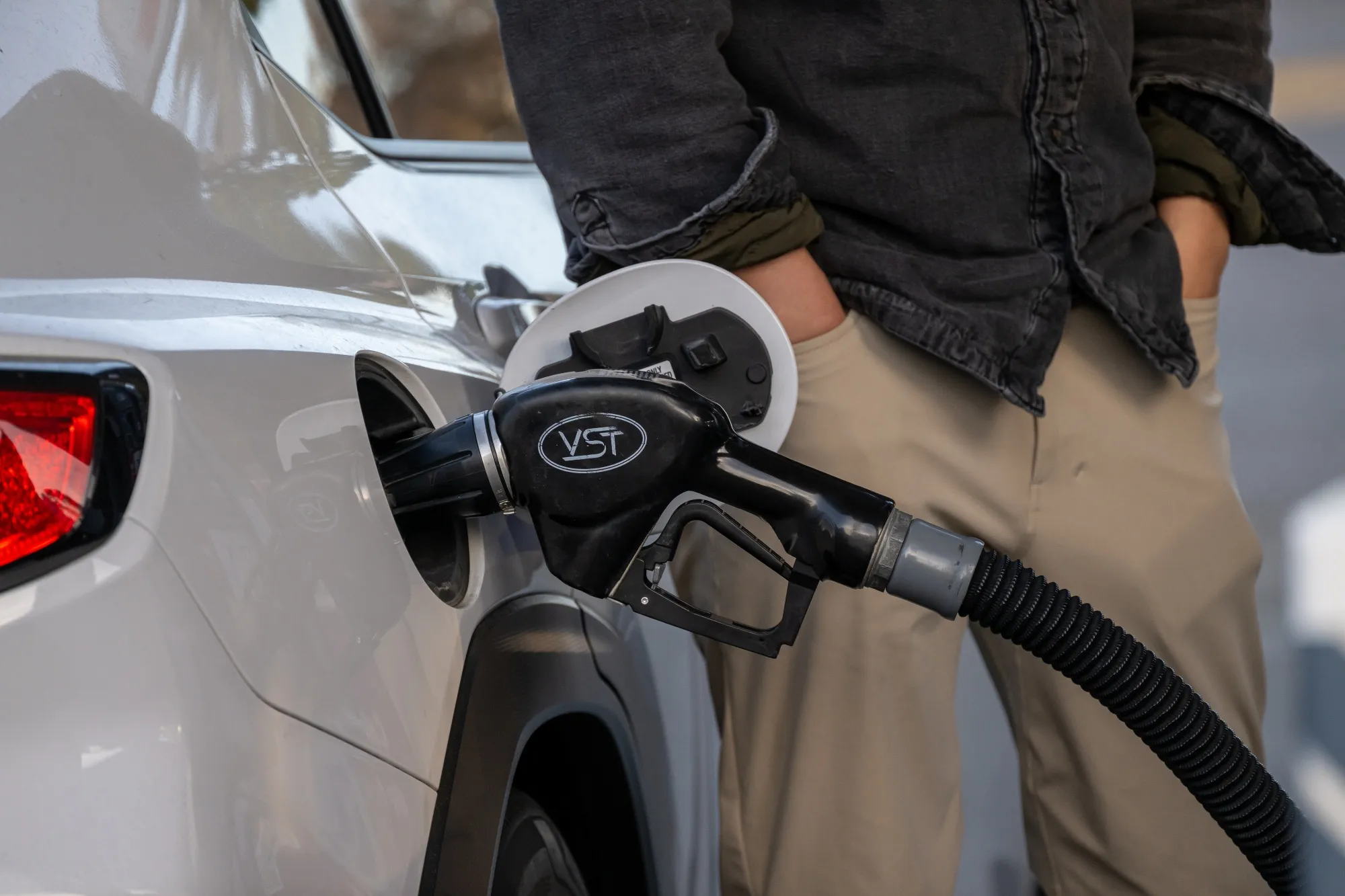 A driver refuels a vehicle at a gas station in Los Altos, California.