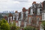 Residential properties in view of the Canary Wharf financial, business and shopping district skyline in London.