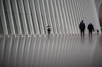 Pedestrians pass in front of the Oculus transportation hub in New York, U.S., on Wednesday, Feb. 26, 2020.