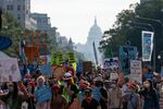 Demonstrators march during a climate change rally in Washington on Oct. 15, 2021.&nbsp;