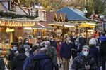 Visitors at a Christmas market in Frankfurt, on Nov. 22.&nbsp;