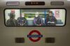 Passengers wear protective face masks as they travel on an underground train in London on March 15. 