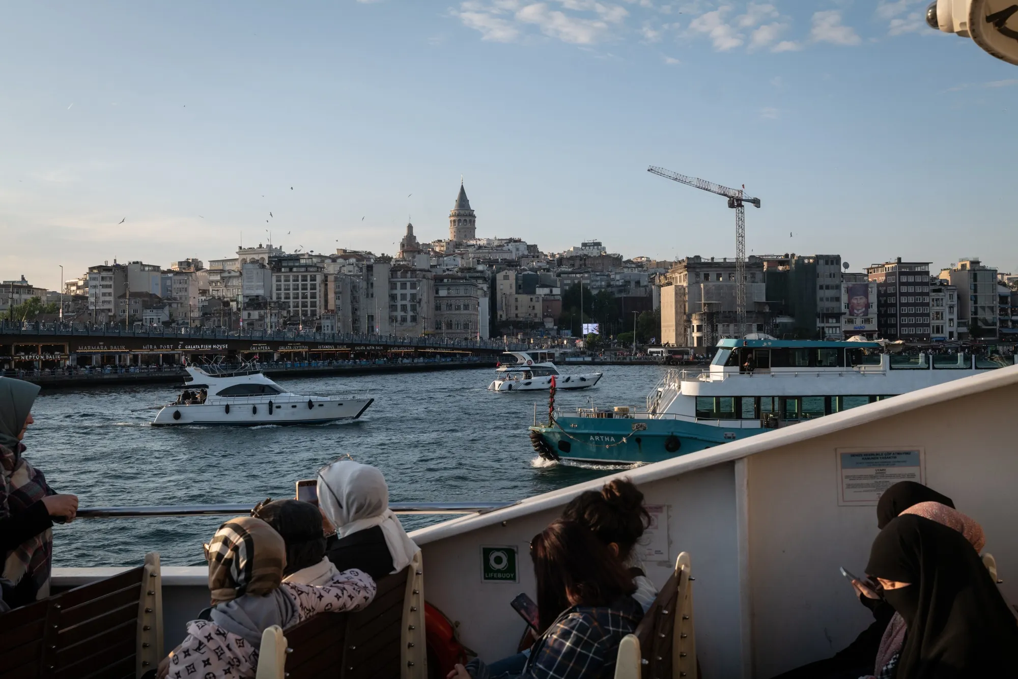Passengers cross the Bosporus Strait on a ferry in Istanbul.