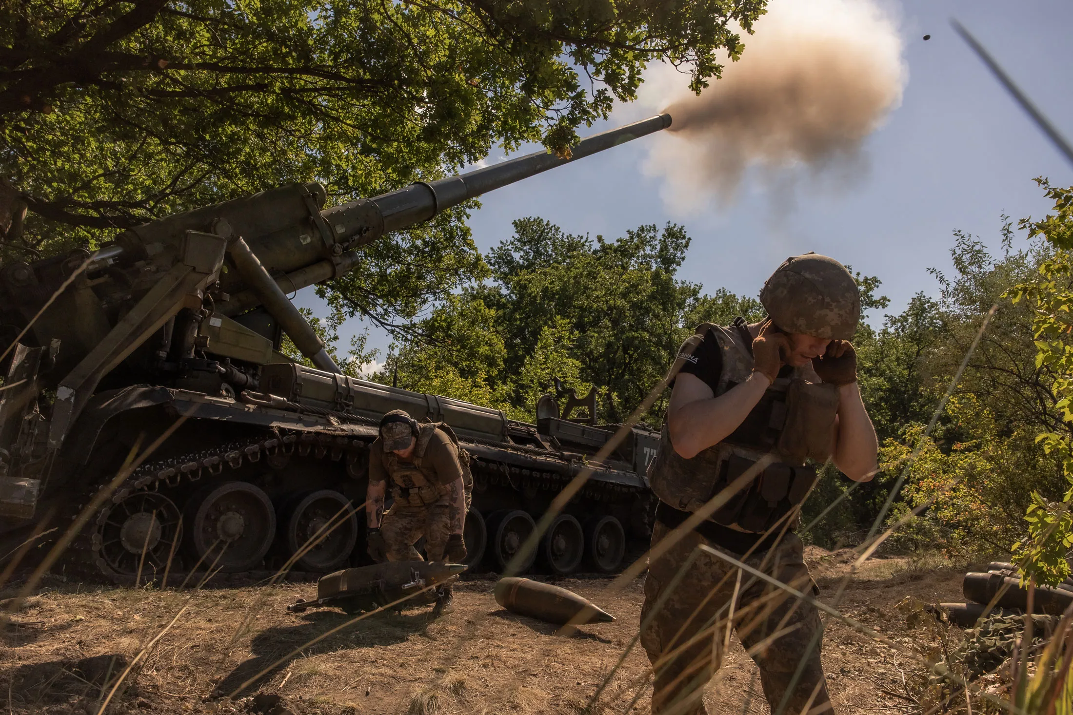 A Ukrainian artillery unit fires towards Russian positions in Pokrovsk district, Ukraine.