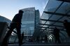 Pedestrians walk towards the Nissan Motor Co. headquarters in Yokohama, Japan.