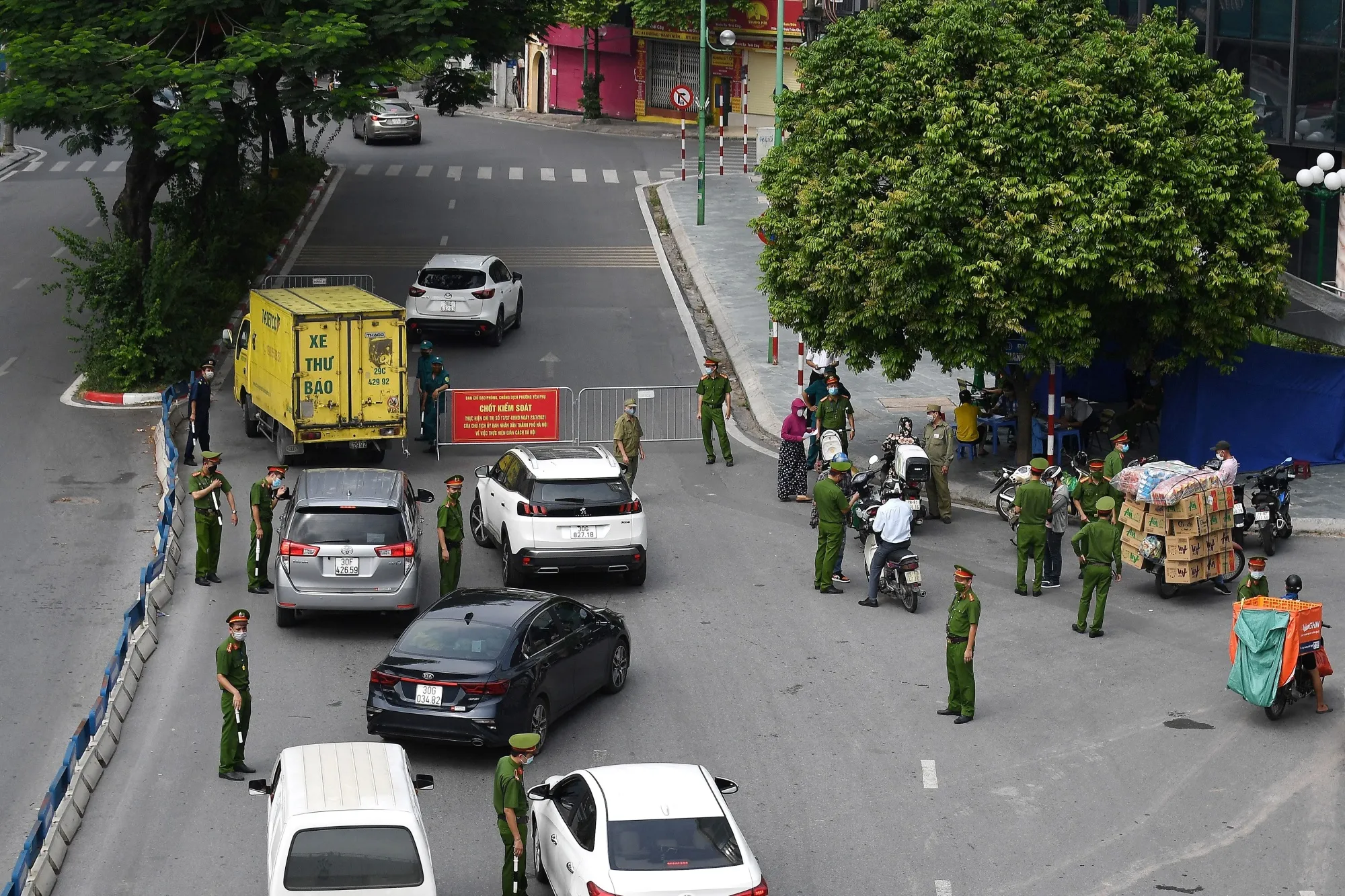 Police check travel documents at a check-point during a lockdown in Hanoi, Vietnam, on July 29.