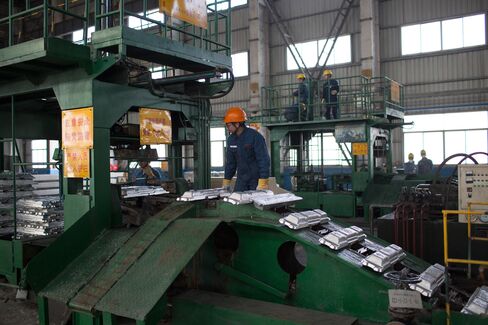 Aluminum ingots are produced at an aluminum smelting factory in Zouping, China, on Nov. 4, 2013.