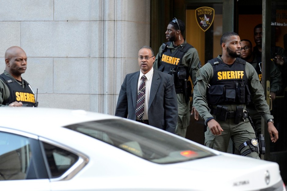 Officer Caesar Goodson leaves the court house in Baltimore on June 14.