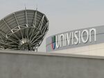 A satellite dish is positioned on the roof of Univision Communications Inc. in Los Angeles.