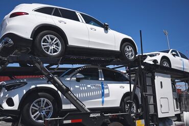 Mercedes-Benz SUVs are unloaded at the Port of Long Beach in California.