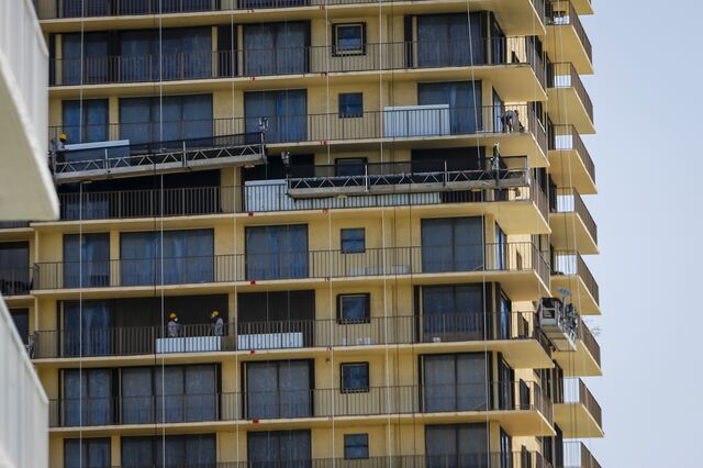 a close-up shot of balconies being repaired