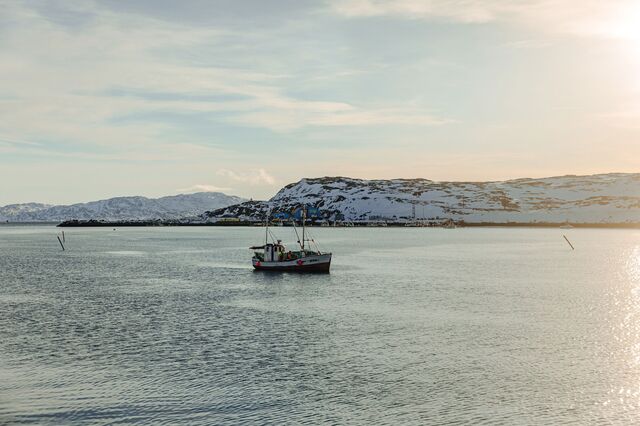A fishing vessel making its way back to the Norway King Crab factory