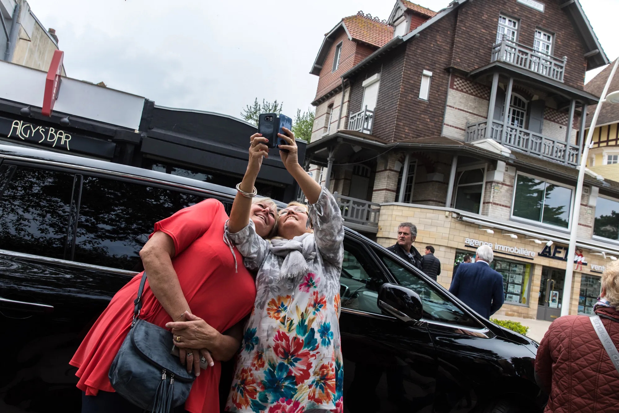 Taking a selfie for the French government won’t be as fun as taking one in front of the president’s house in Normandy.
