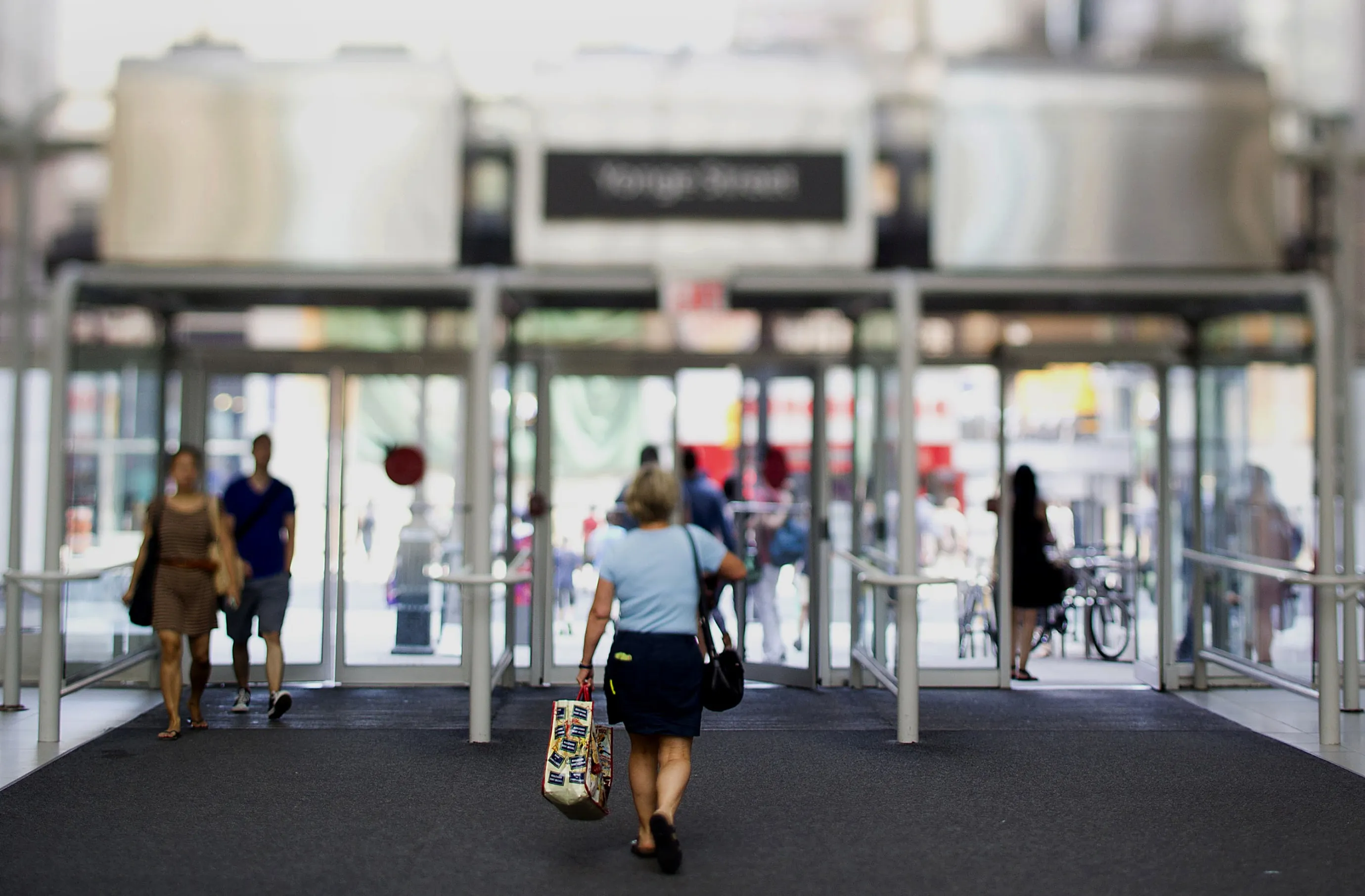 Shoppers exit the Eaton Centre mall in Toronto.