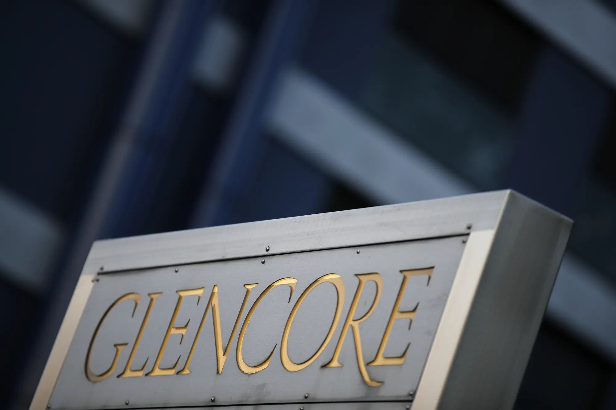 Signage stands near the Glencore Plc headquarters office in Baar.