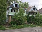 Abandoned homes in East Cleveland, where a land conservancy has been working to acquire vacant properties. 