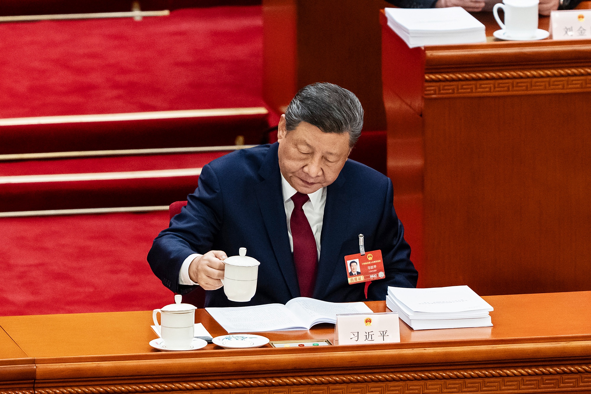 Xi Jinping, China's president, attends the opening session of the National People's Congress at the Great Hall of People in Beijing, China, on Thursday, March 5, 2026. China set its most modest growth target since 1991, in a tacit acknowledgment that the model powering the country's rapid rise for the past four decades is showing strains. Photographer: Qilai Shen/Bloomberg