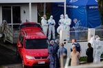 Investigators work at a scene after bodies were discovered in suitcases, in Auckland, New Zealand.&nbsp;