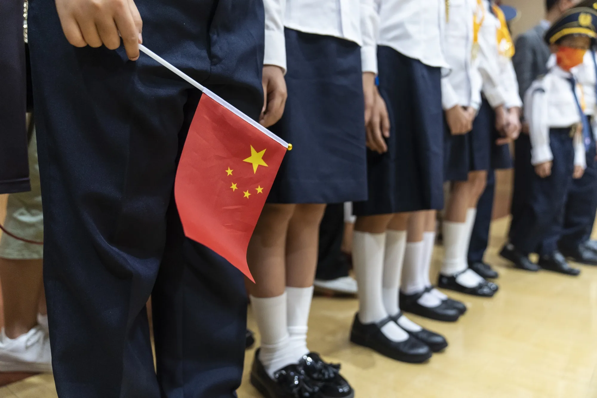 A student holds the Chinese national flag&nbsp;in Hong Kong, China.
