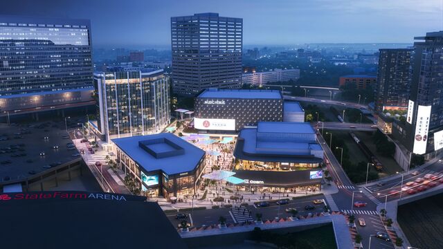 A rendering showing an aerial view of Centennial Yards featuring varius music and entertainment venues at night. 