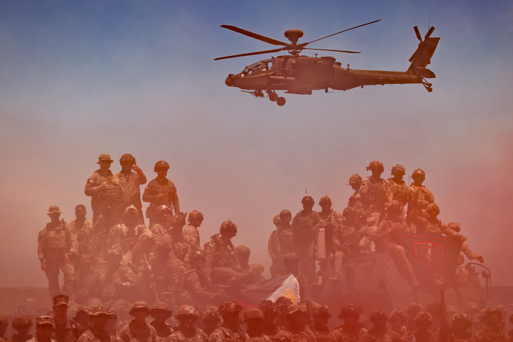 U.S., Japanese and Philippine troops pose for pictures during the annual Balikatan joint military drills in the Philippines on May 4, 2026. Photographer: Ezra Acayan/Getty Images