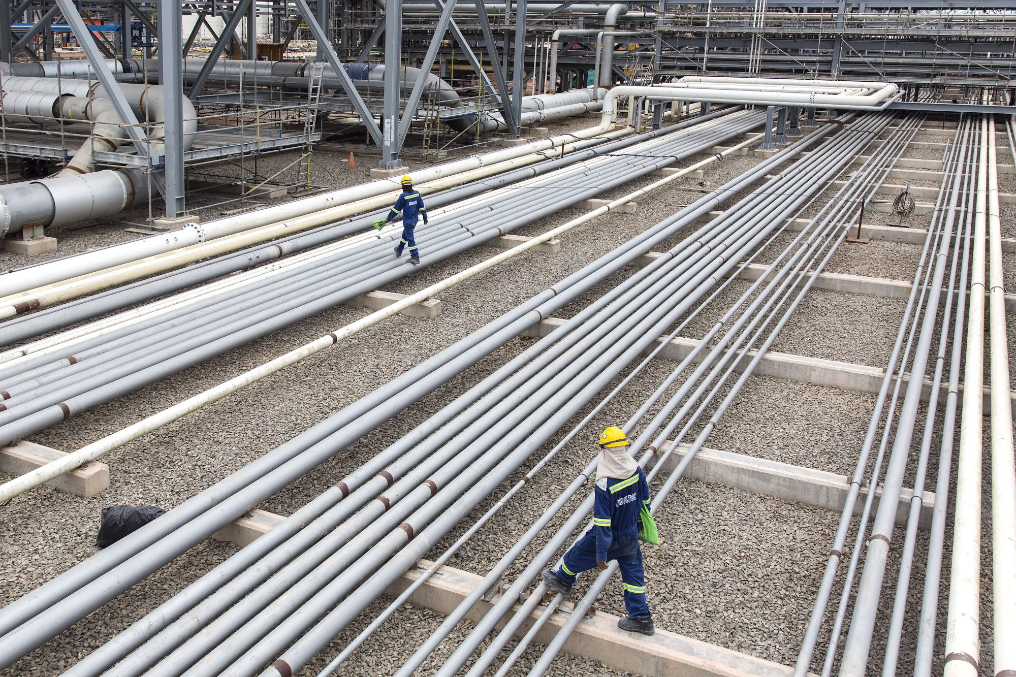 Workers at a Petroliam Nasional Bhd. site in Johor, Malaysia.