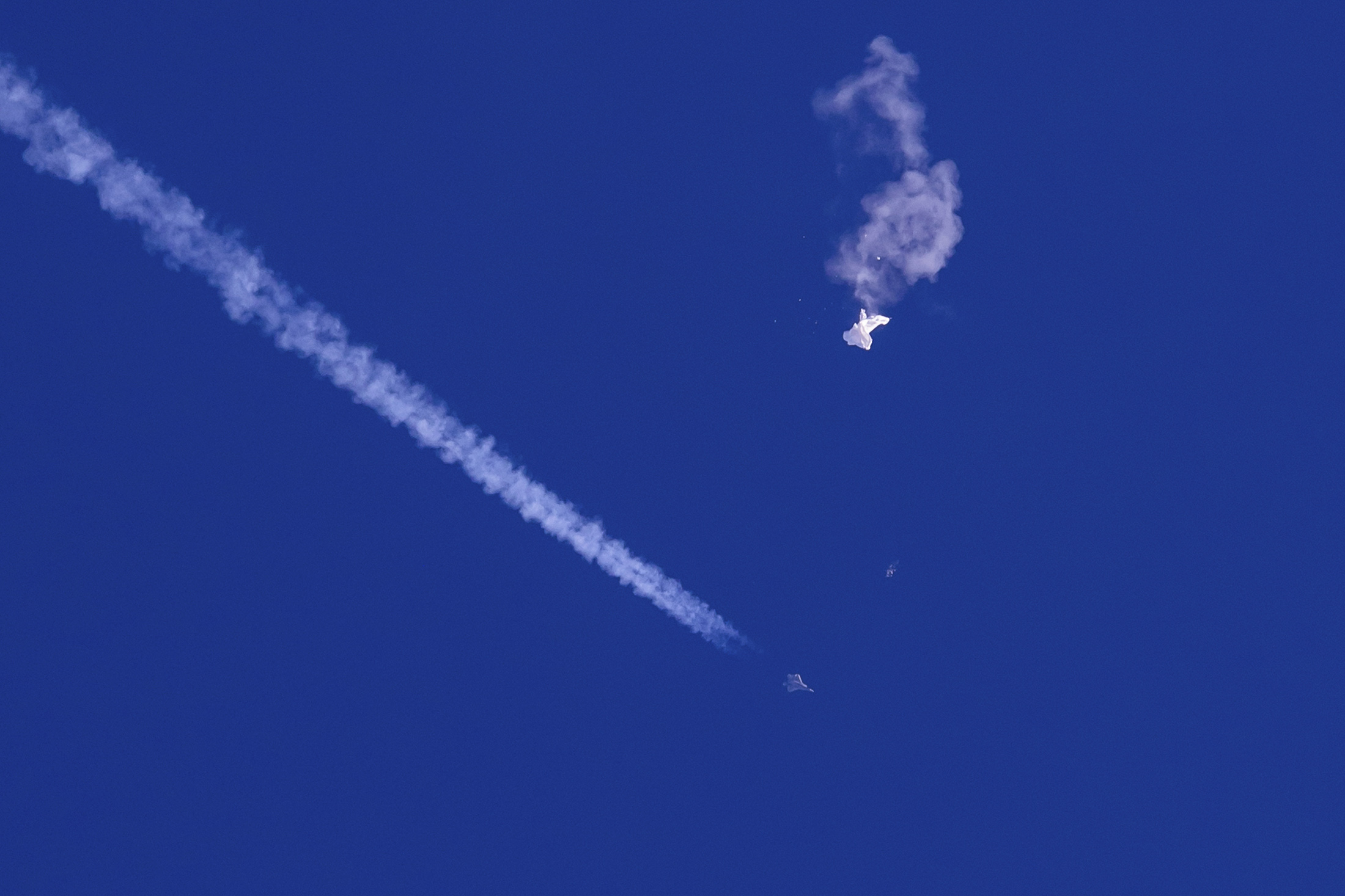 A fighter jet shoots down a suspected Chinese spy balloon over the Carolina coast on Feb. 4.