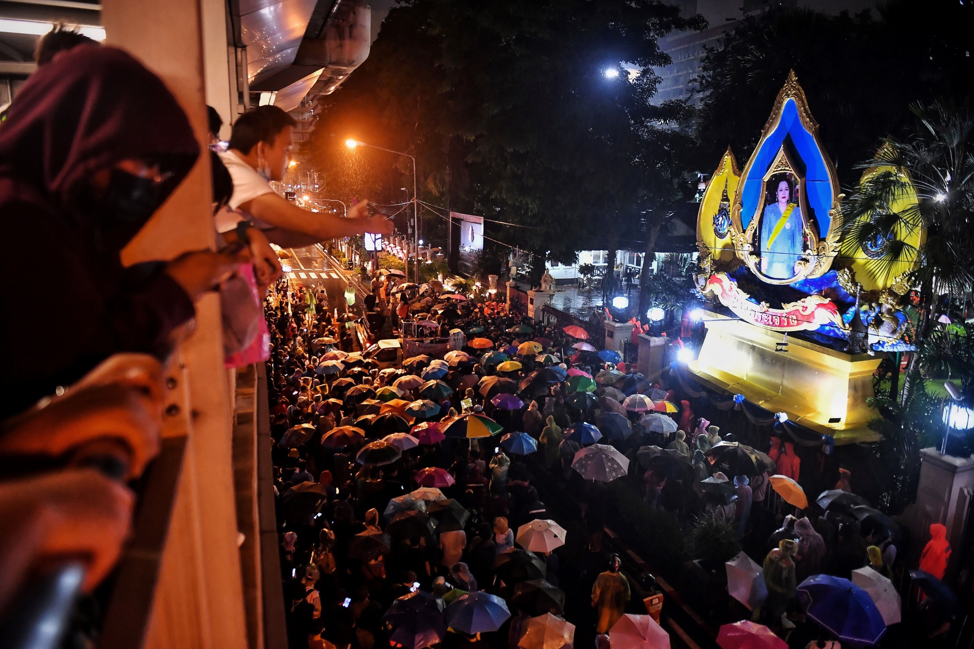 Protesters gather outside the police headquarters in Bangkok on Oct. 13.
