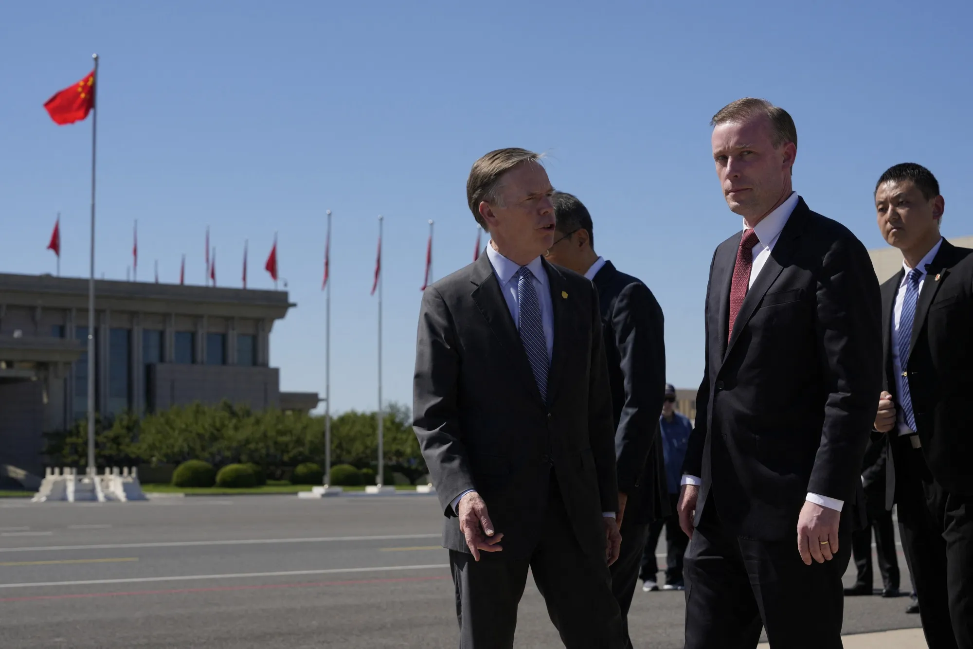 Jake Sullivan, center, with Nicholas Burns, US Ambassador to China, left, upon arriving at Beijing Capital International Airport on Aug. 27. 