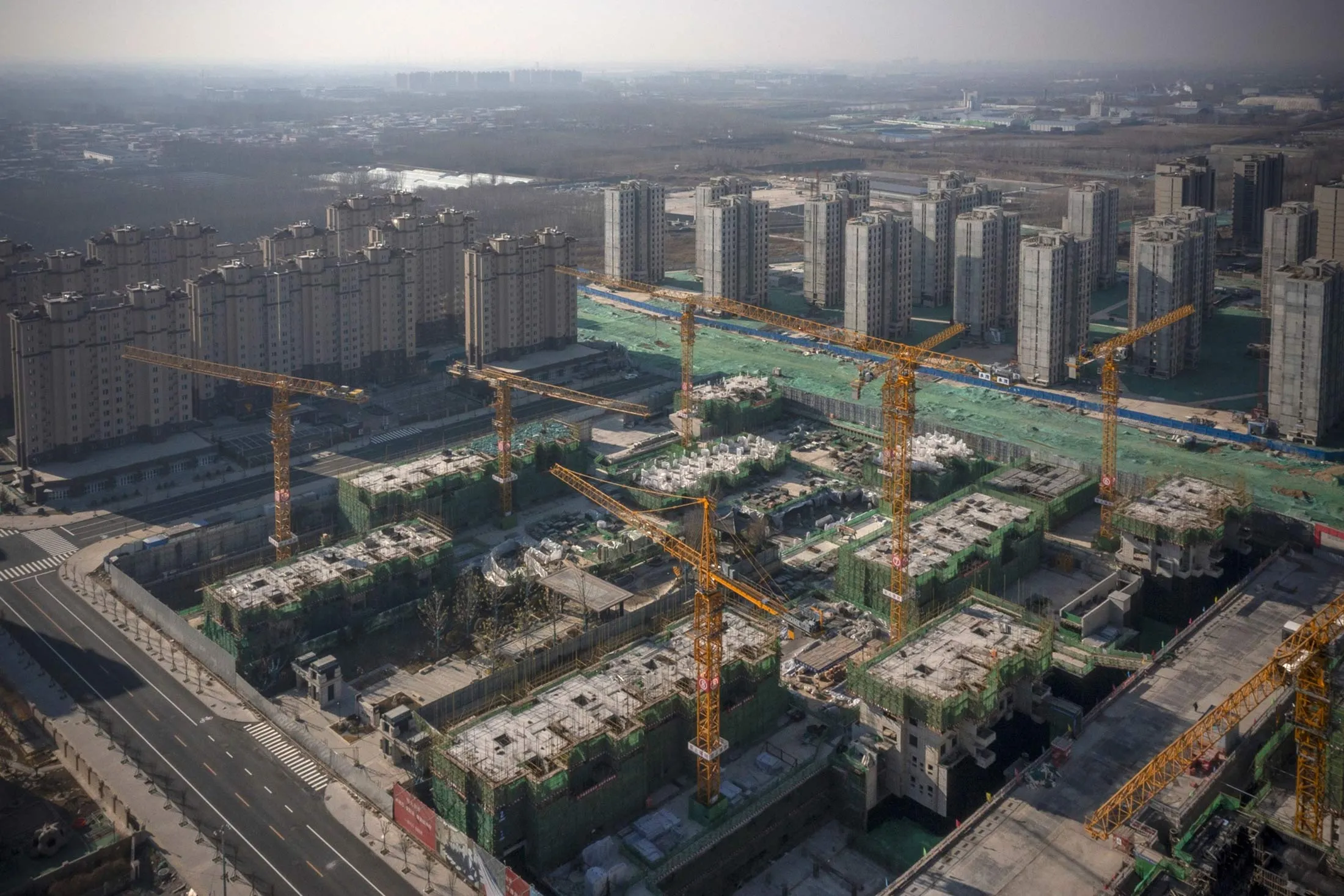 Unfinished apartment buildings at the construction site of a China Evergrande Group development in Beijing.