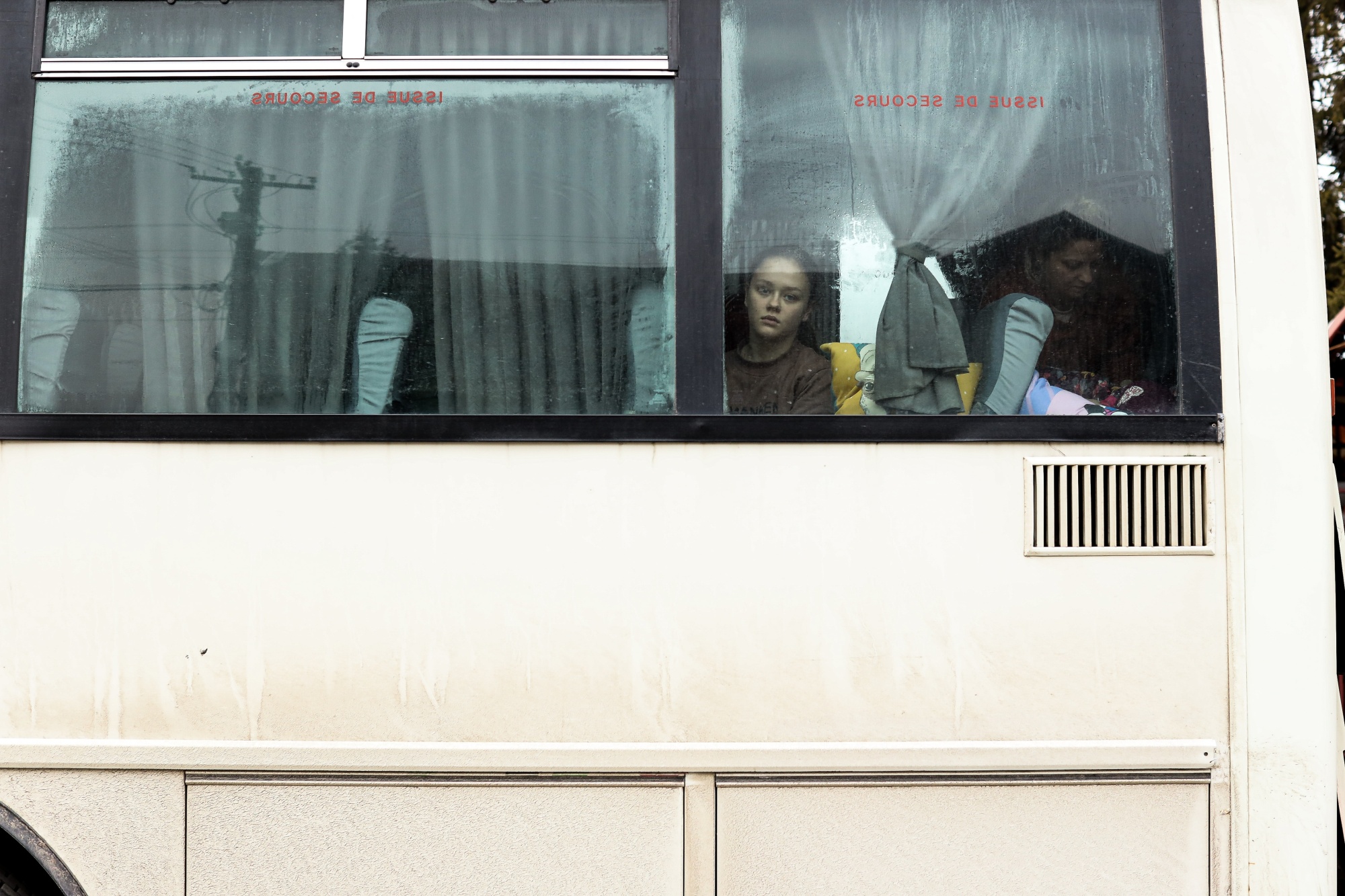 A displaced Ukrainian girl travelling by bus at the Poland border crossing in Shehyni, Lviv Oblast, Ukraine, on March 2.