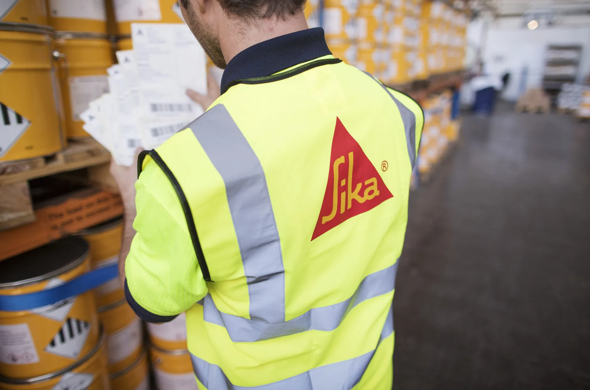 An employee checks stock of Sikalastic coating at a Sika&nbsp;manufacturing facility.