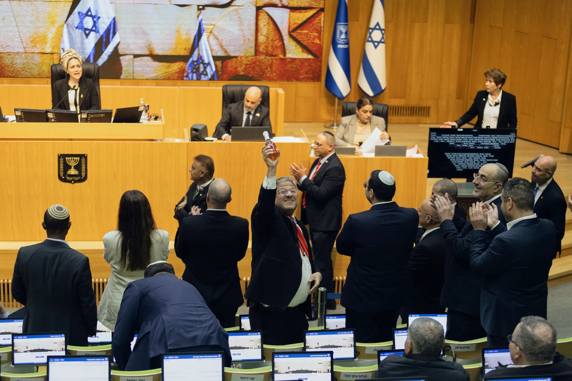 Lawmakers including Israel's Minister of National Security, Itamar Ben-Gvir, center,&nbsp;after Israel's parliament passed a law approving the death penalty for Palestinians convicted of lethal terrorism, at the Knesset in Jerusalem on March 30.