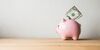 Pink piggy bank on a white background
