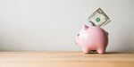 Pink piggy bank on a white background