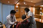 A doctor administers a dose of the Pfizer-BioNTech vaccine at a nursing home in Kawasaki, on April 12.