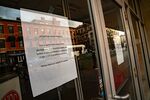 A sign notifying facility closure hangs on a window of a New York Sport Club&nbsp;location in Hoboken, New Jersey&nbsp;on&nbsp;March 16.&nbsp;