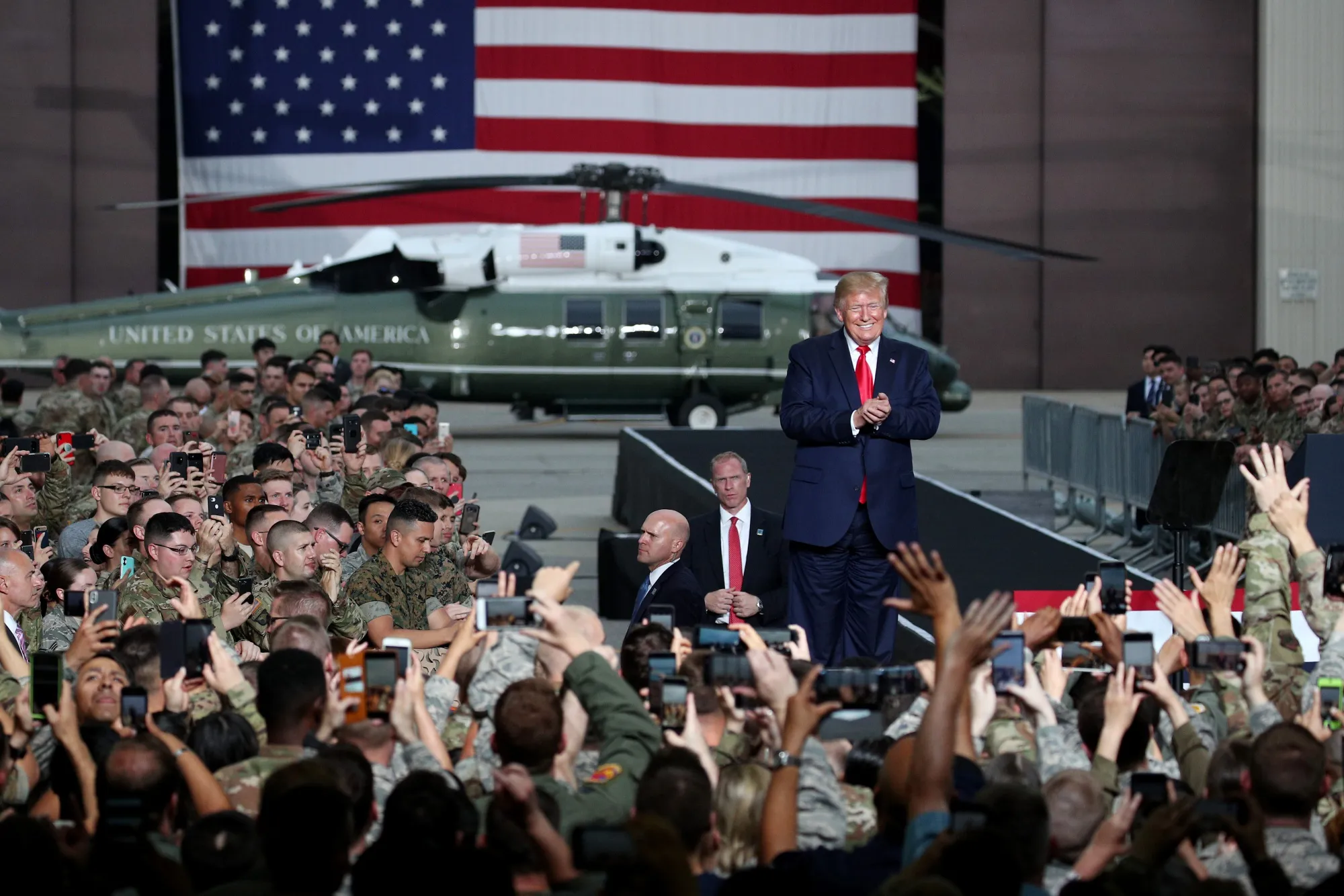 Donald Trump with US military personnel at Osan air base in Pyeongtaek, South Korea, in June 2019. 