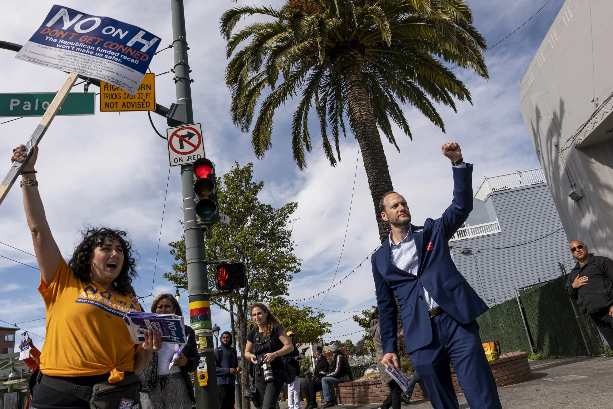 Chesa Boudin, right, gestures to supporters in San Francisco on June 7.