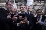 Emmanuel Macron flies a drone next during a visit to the Renault factory in northeastern France, on Nov. 8.