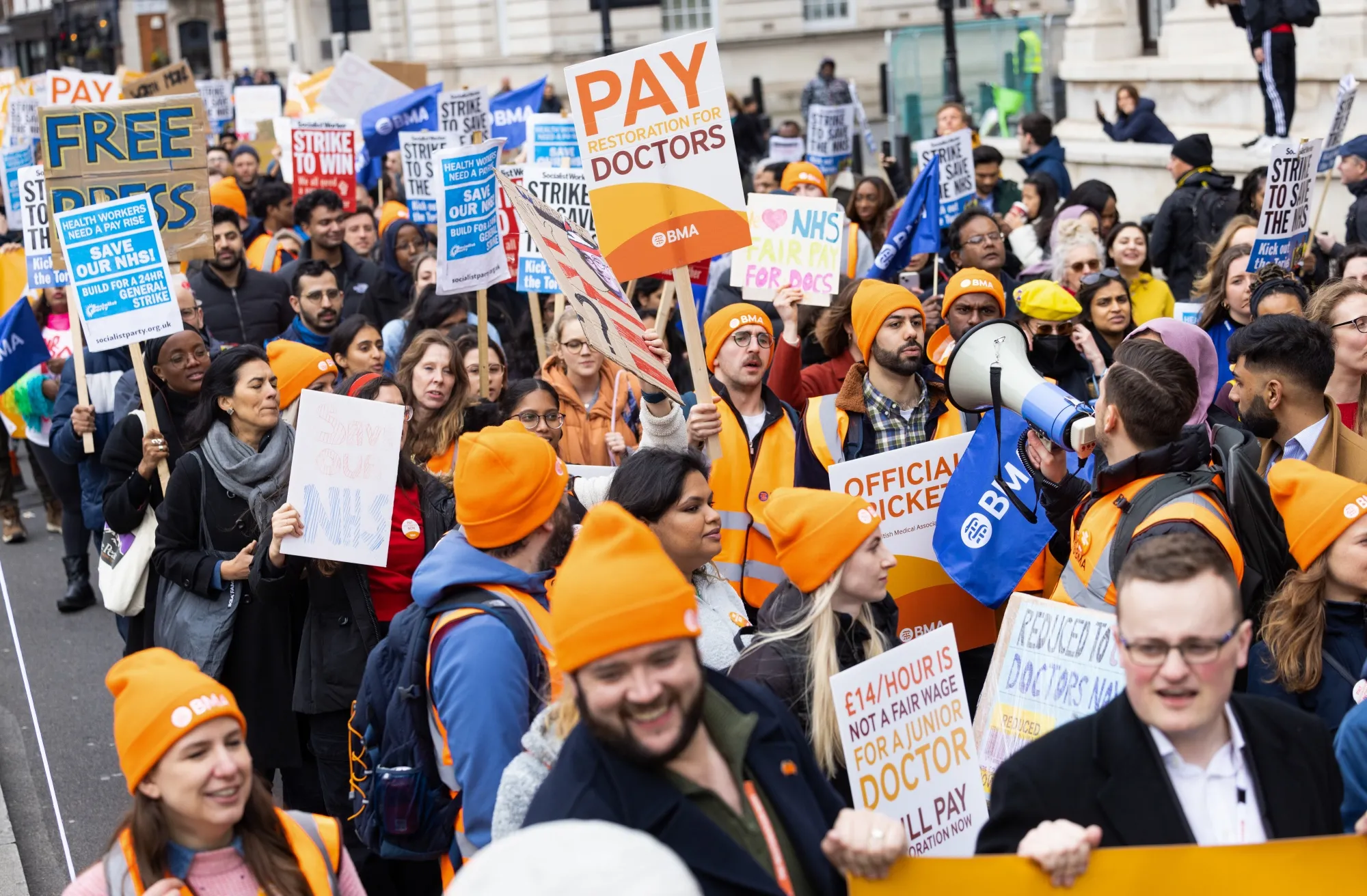 Junior doctors march from Trafalgar Square to the Houses of Parliament during strike action in London.