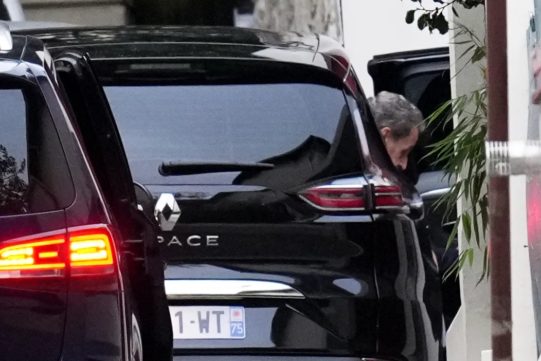 Nicolas Sarkozy arrives at his residence in Paris, on Nov. 10.