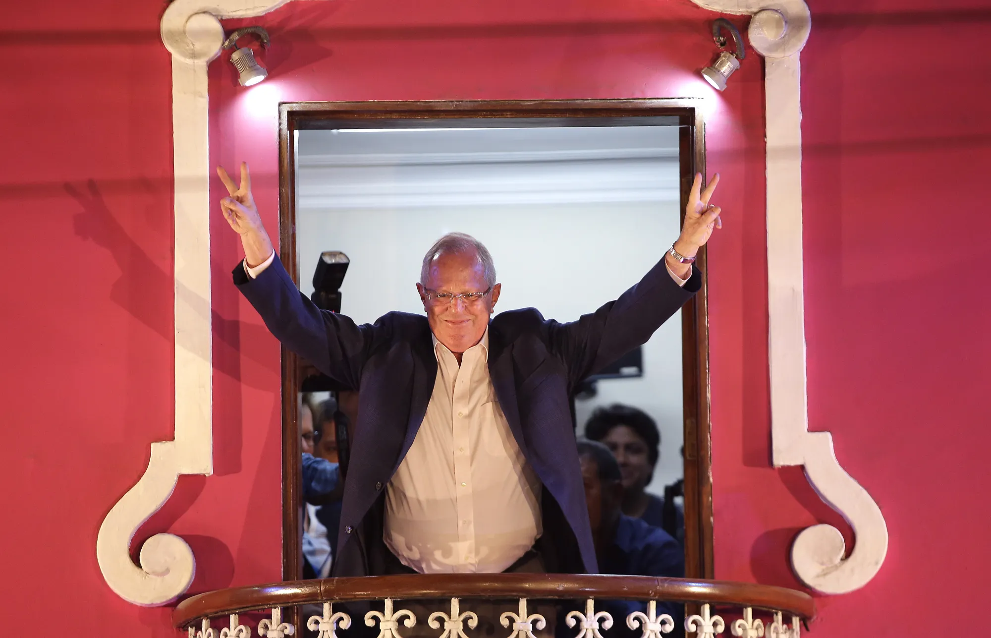 Pedro Pablo Kuczynski, a former central banker and presidential candidate, waves at supporters from a balcony in Lima.
