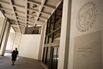 A woman walks in front of the International Monetary Fund bu