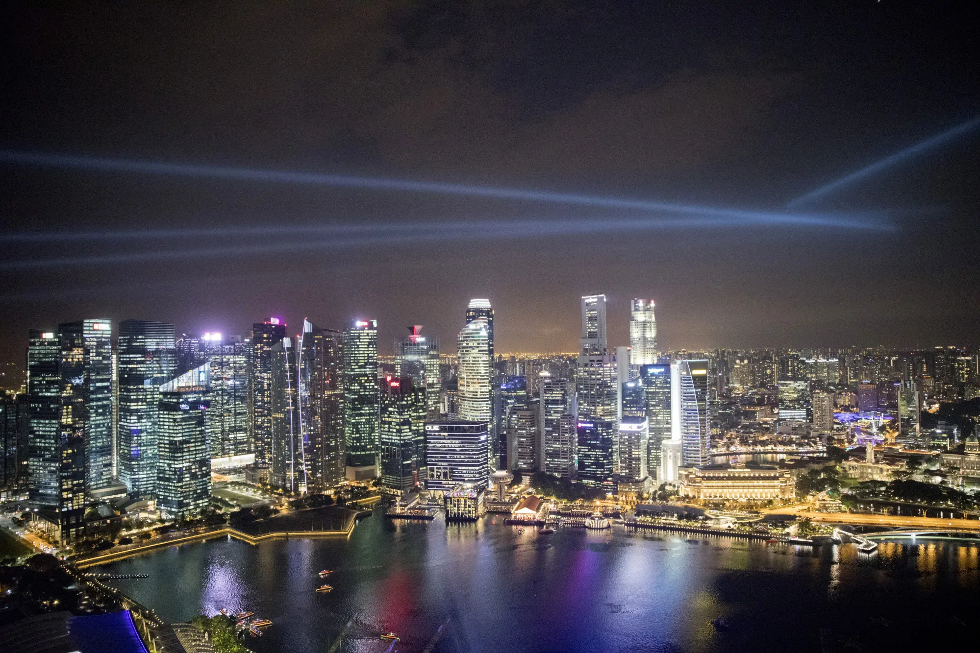 Commercial buildings in the central business district are illuminated at night in Singapore.