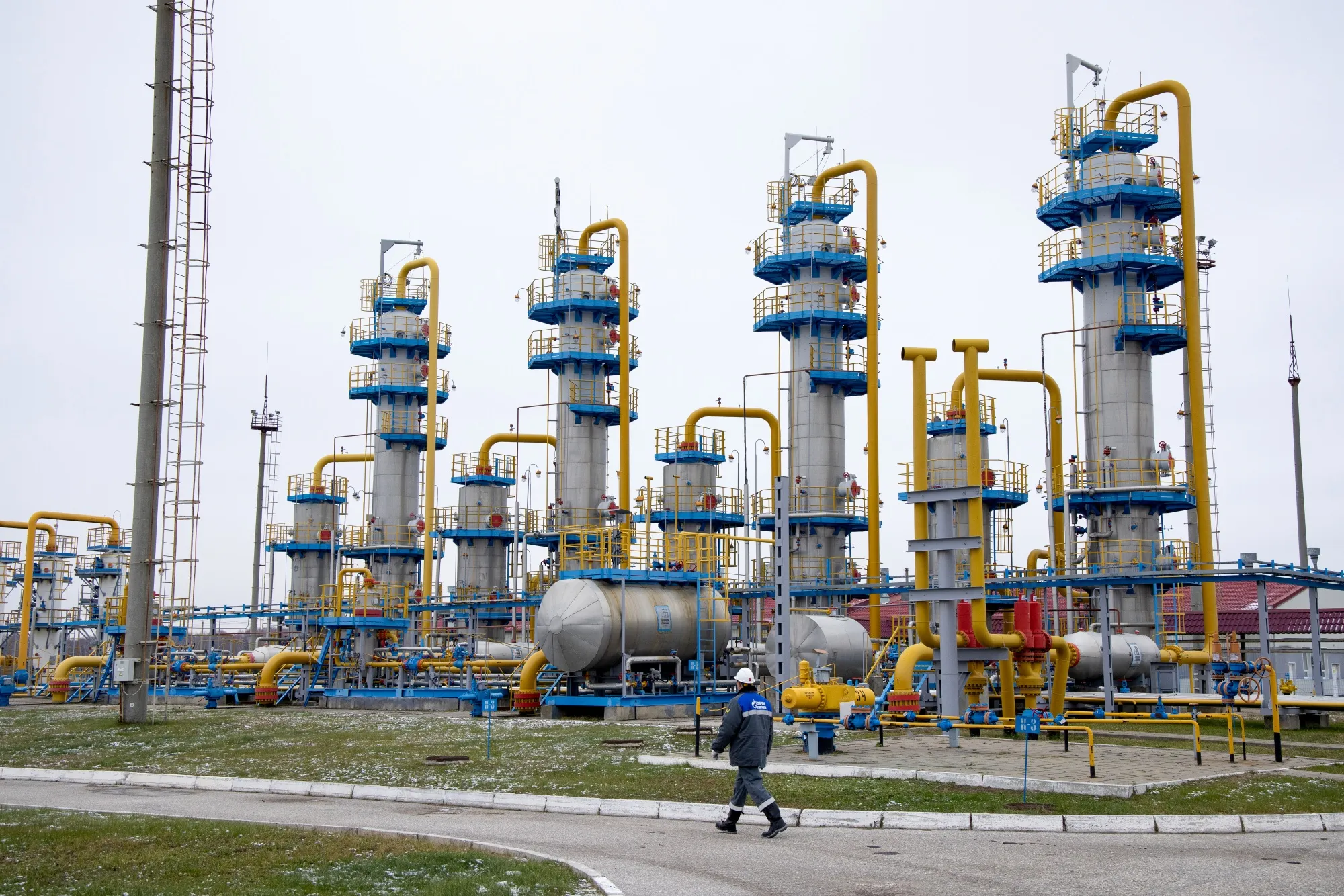 A worker passes a gas treatment unit at the Kasimovskoye underground gas storage facility, operated by Gazprom PJSC, in Kasimov, Russia.