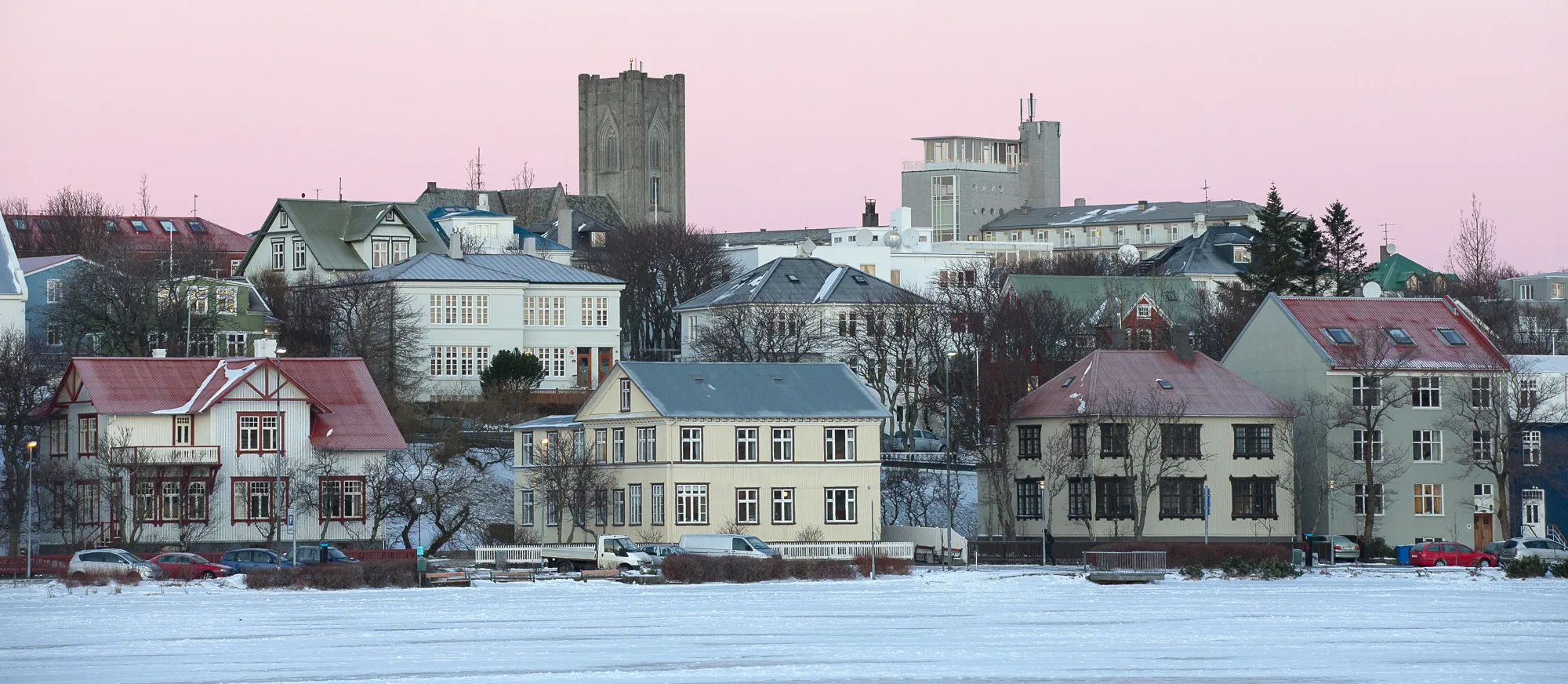 Residential property sits beside a frozen waterway in Reykjavik, Iceland