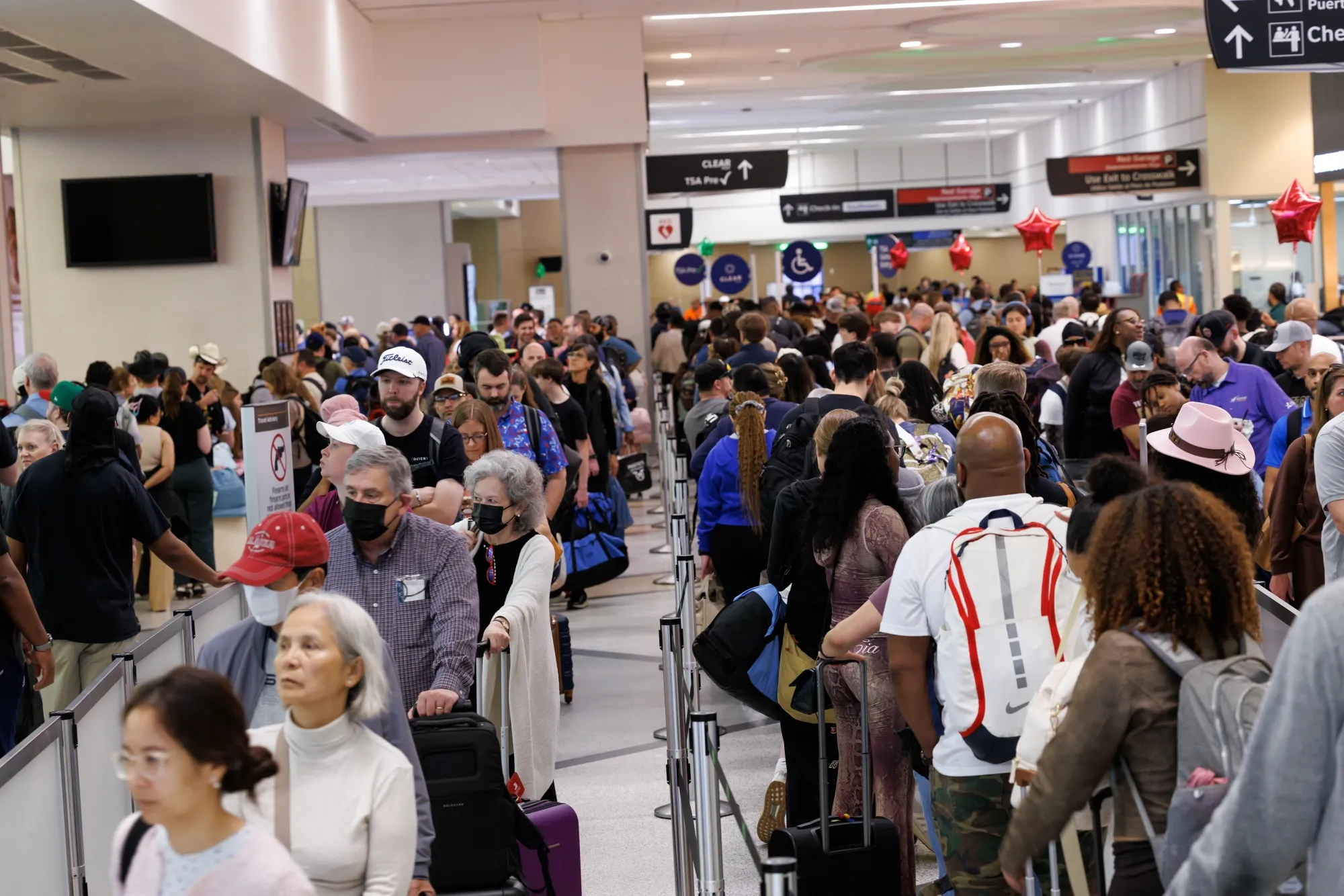 Travelers wait in line at a Transportation Security Administration&nbsp;checkpoint at William P. Hobby Airport in Houston on March 9.